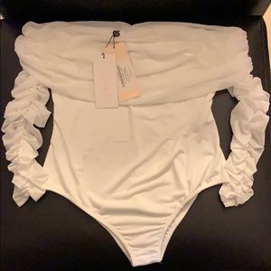 White body suit and a white Tube top